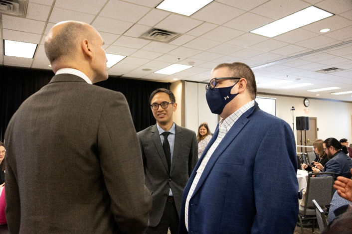 The Honourable Jean-Yves Duclos, Minister of Health, speaking with Dr. Mackenzie Salt and Dr. Jonathan Lai.